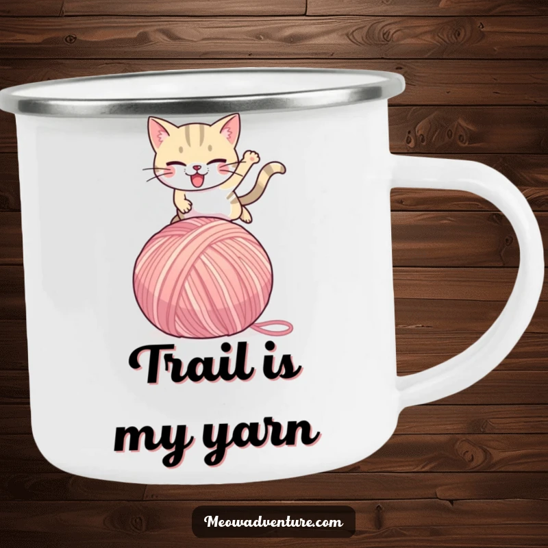 Funny Cat Camping Mug: A determined cat leaps over a giant yarn ball, ideal for rugged adventures and humorous sipping.