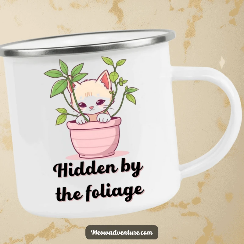 Stealthy kitten camping mug showing a cat peeking from behind a potted plant, designed for durable and playful outdoor enjoyment.