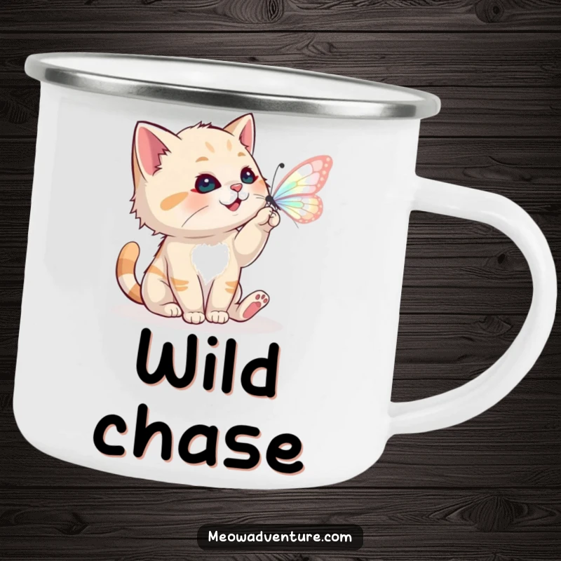 Funny camping mug showing a playful cat batting at a magical butterfly, for outdoor whimsical enjoyment.