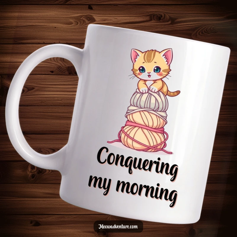 Funny Determined Kitten Mug showing a brave kitten climbing a huge stack of colorful yarn balls. A humorous gift for achievers.