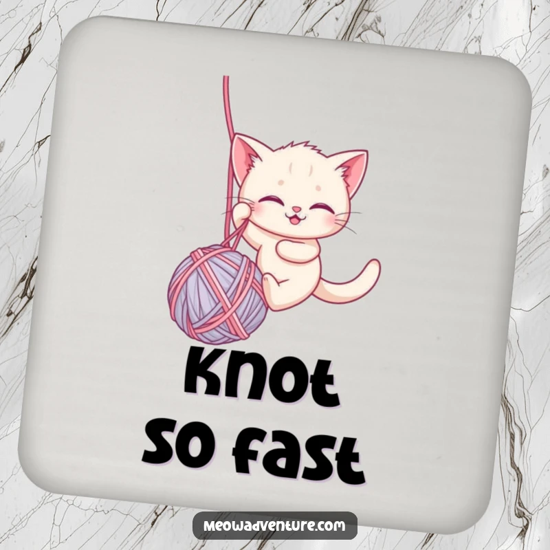 Funny drink coaster featuring a brave kitten rappelling down a ball of yarn, adding a humorous and protective element to any surface.