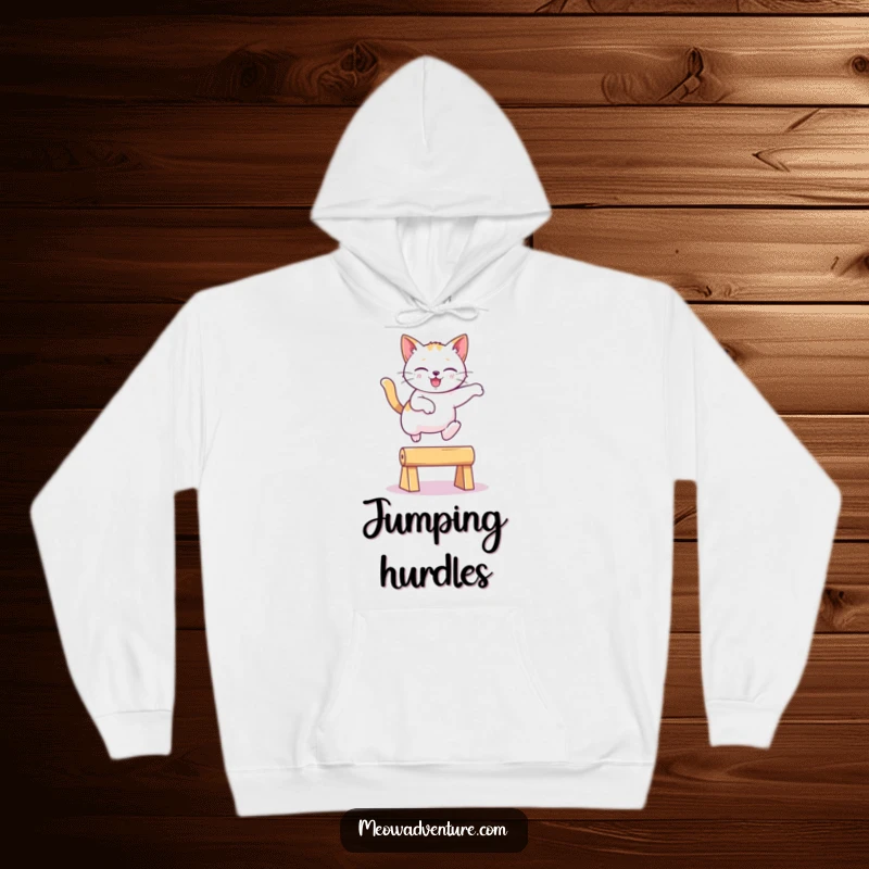 Funny playful cat leaping gracefully over an imaginary obstacle in a cozy hoodie, a warm and funny gift.
