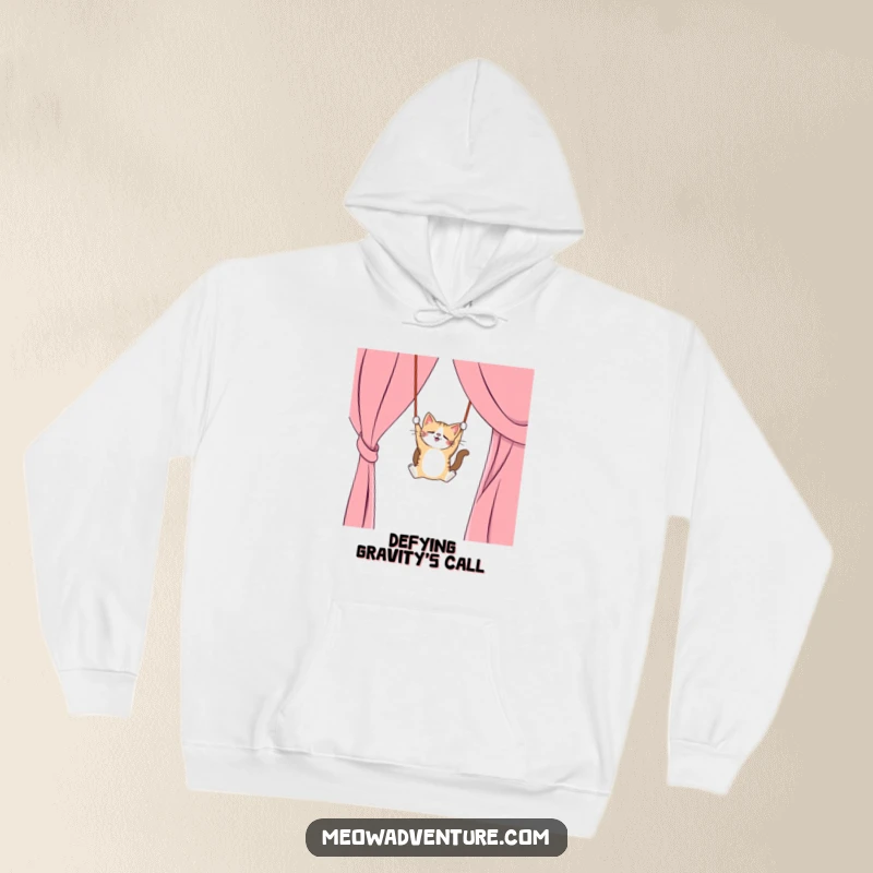 Funny hoodie design of a mischievous cat swinging from a curtain like a trapeze artist, cozy and humorous apparel, great funny gift.