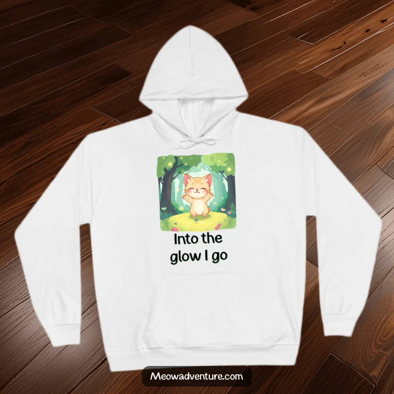 Funny warm hoodie showing a curious cat with paws outstretched, exploring a vibrant, glowing magical forest.