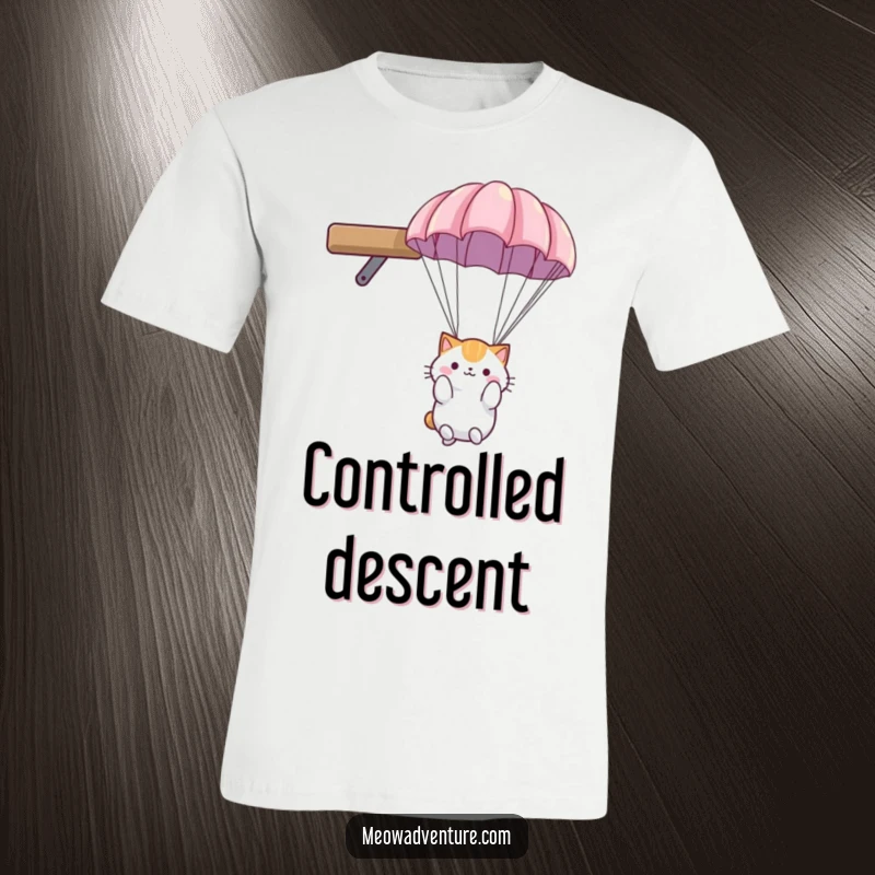 Funny cat t-shirt: fluffy cat with a small parachute, descending calmly from a high shelf, looking ready to land.