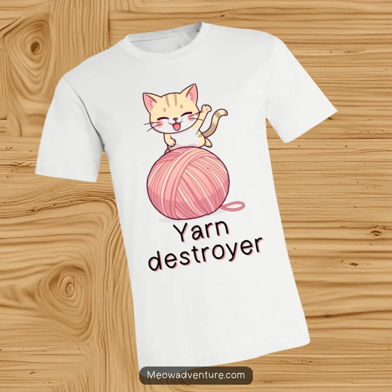 Funny Cat T-Shirt: A determined cat character is captured mid-air, leaping over a comically large ball of yarn, exuding energetic humor.