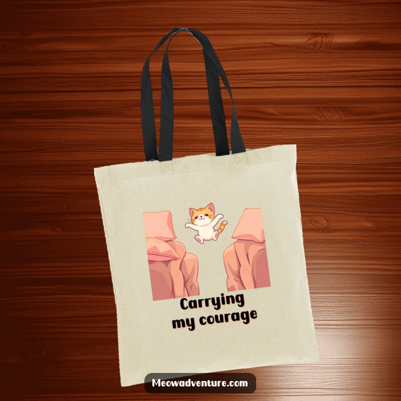 Funny tote bag showcasing a cat mid-leap, bravely crossing a gap between cushions, symbolizing ambition and playful adventure.