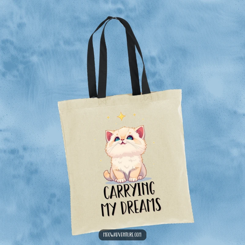 Funny fluffy kitten gazing at a starry night sky, printed on a durable tote bag, perfect for carrying dreams.