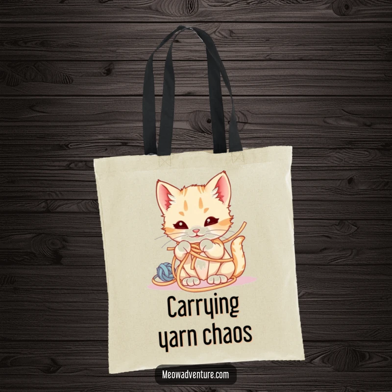 Funny Tote Bag showcasing a kitten with a smirk, hilariously wrapped up in a ball of yarn, ready for adventures.